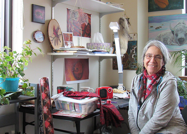 Woman sitting at craft desk